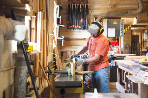 An American-made wooden table saw crafted with precision in a woodshop.