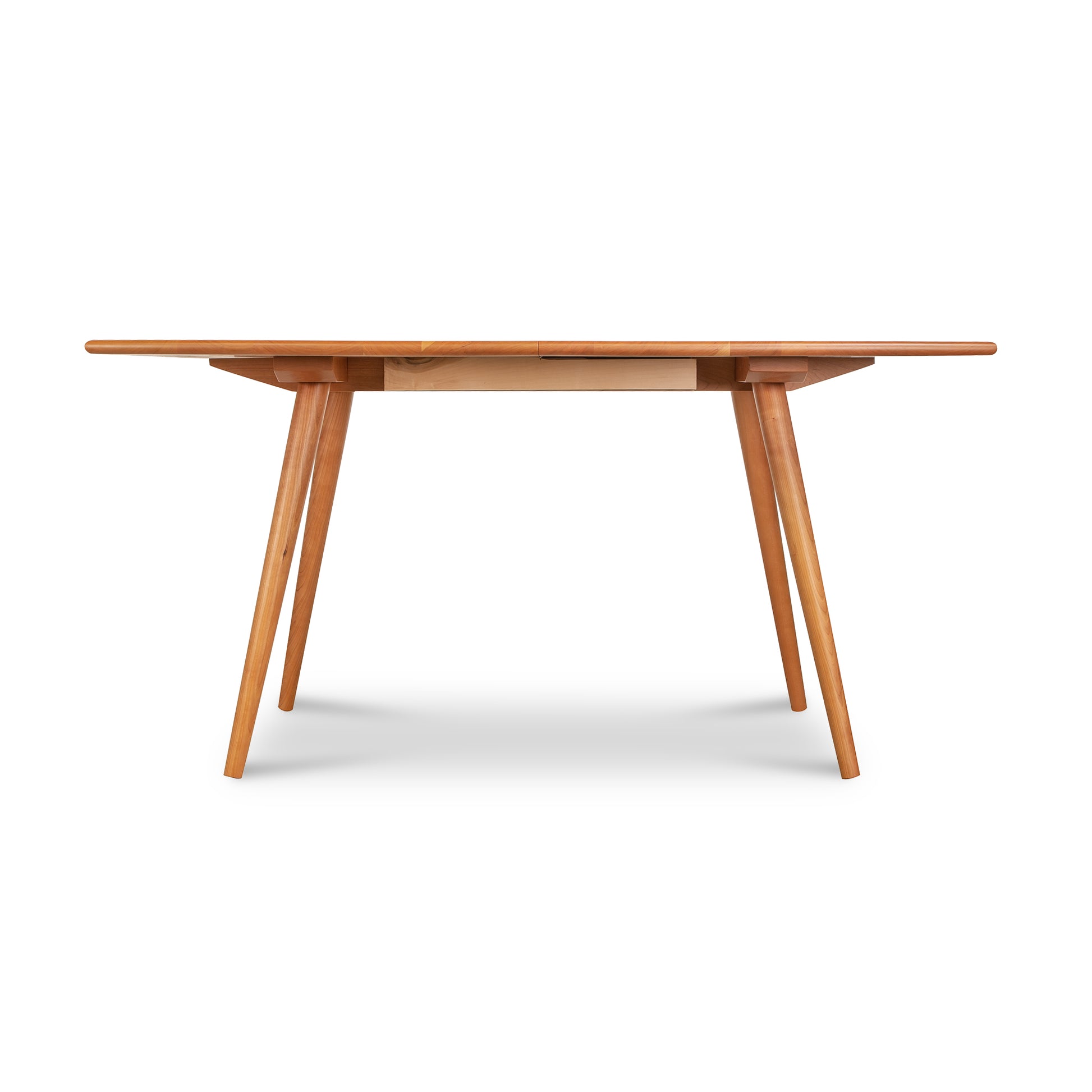 Lyndon Furniture Addison Boat Top Extension Dining Table with mid-century modern angled legs.