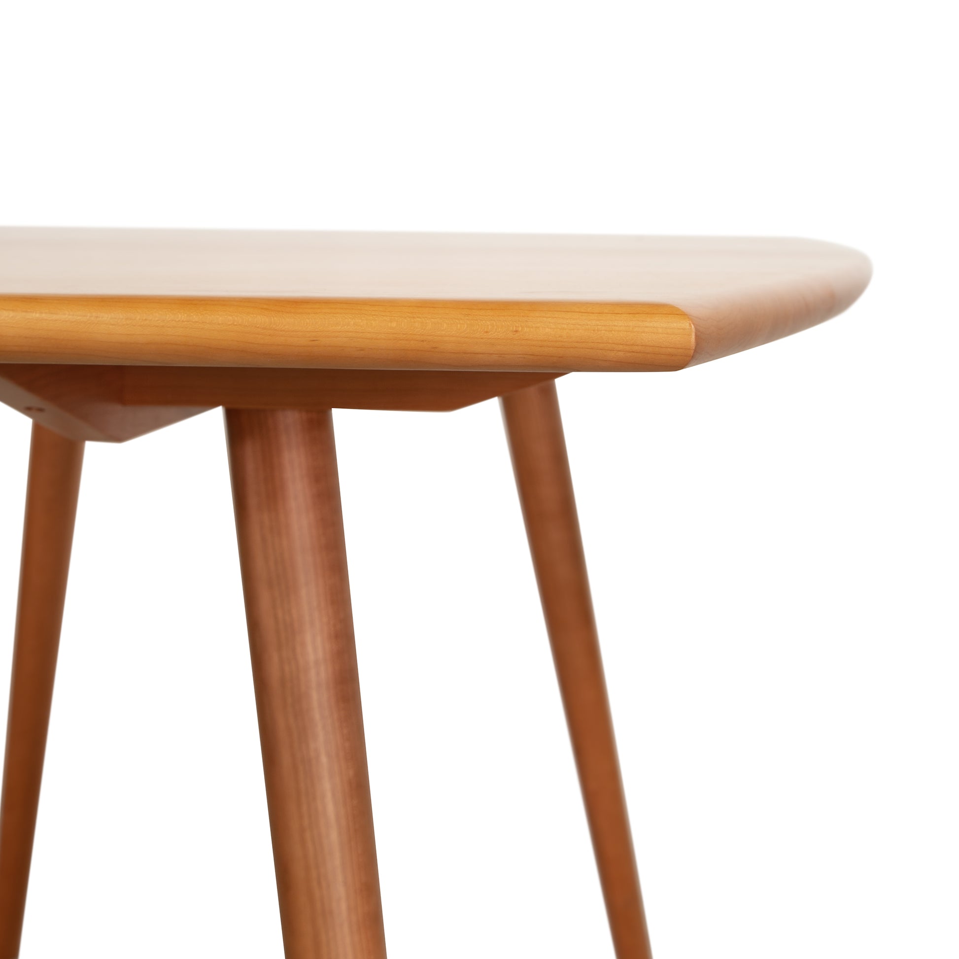 Addison Boat Top Extension Table by Lyndon Furniture showcasing a round top with four angled legs in a minimalist design.