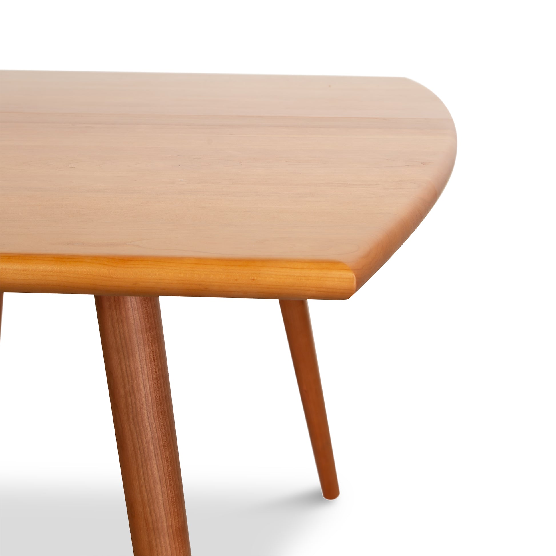 Addison Boat Top Extension Dining Table with rounded edges and tapered legs, handcrafted by Lyndon Furniture in Vermont.