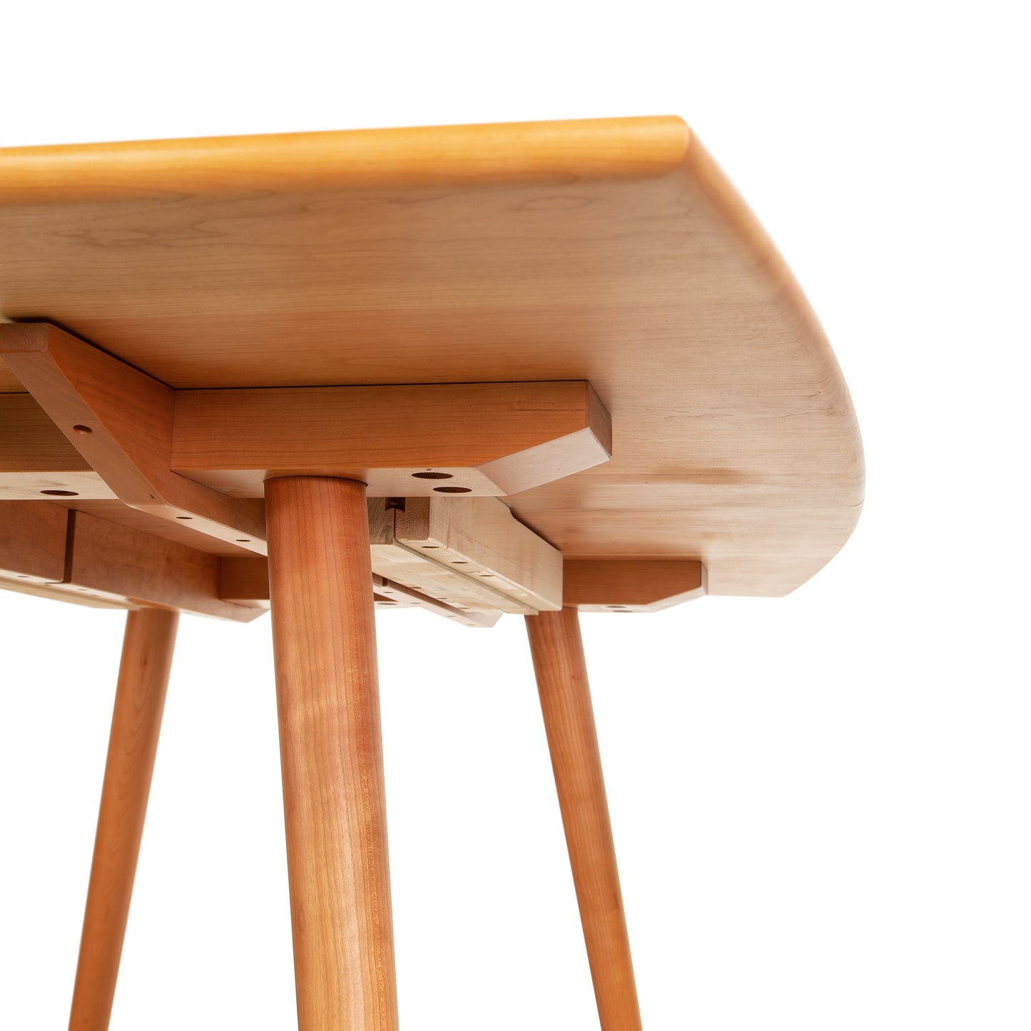 A mid-century modern Lyndon Furniture wooden table with two legs, perfect for a dining room in Vermont.