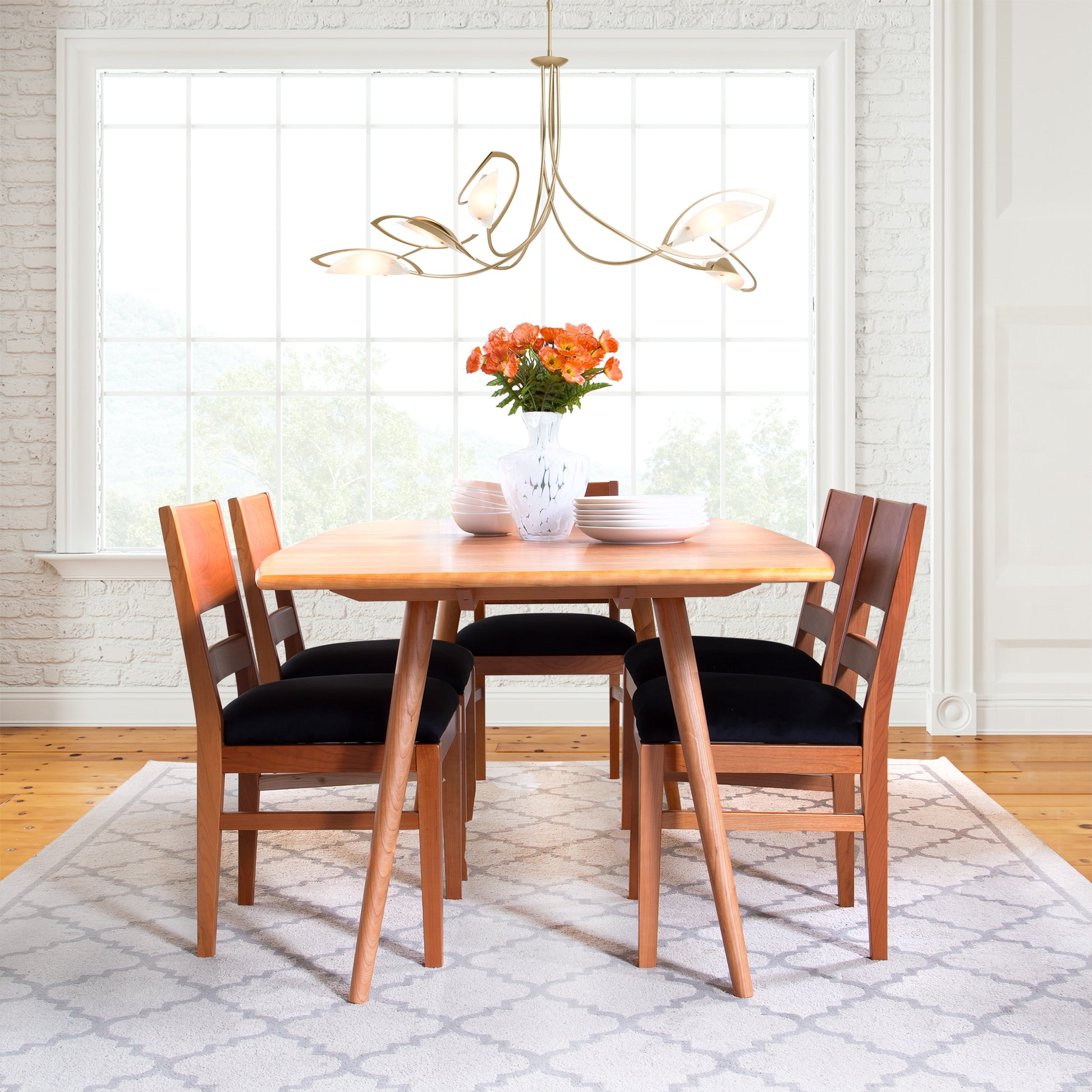 The Addison Boat Top Table by Lyndon Furniture with four chairs, handcrafted in Vermont.