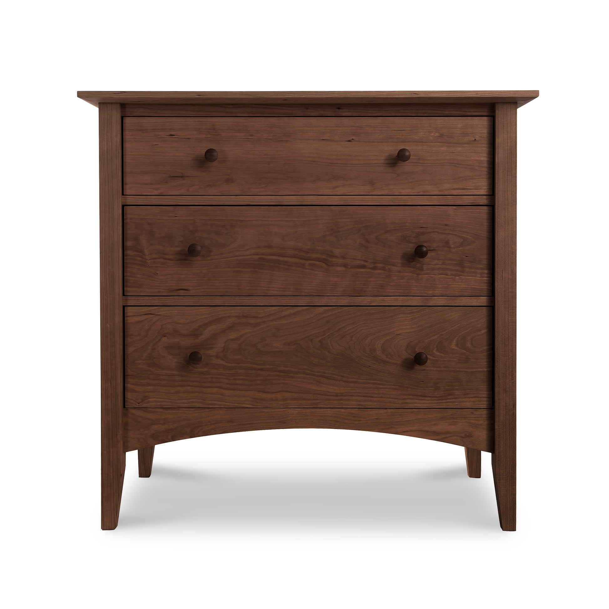 A Maple Corner Woodworks American Shaker 3-Drawer Chest featuring three drawers of varying sizes, a smooth finish, and tapered legs. The sustainably harvested natural solid wood has a rich, brown color and prominent grain patterns.