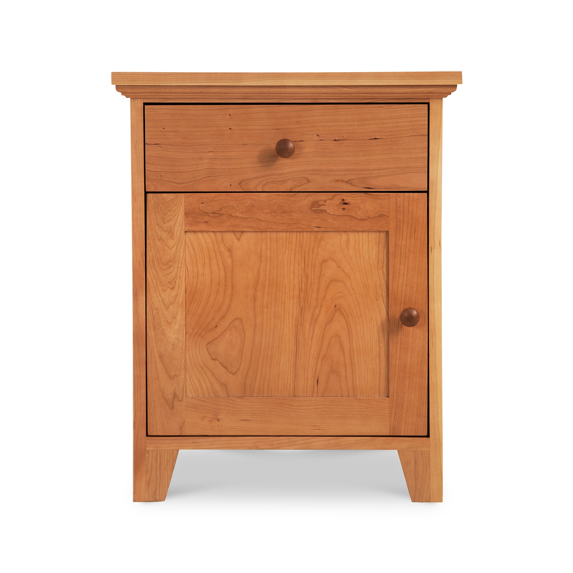 Handcrafted solid wood nightstand with drawer, door, and round handles in classic American Country style by Lyndon Furniture.