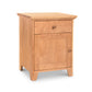 A small wooden American Country 1-Drawer Nightstand with Door made by Lyndon Furniture.