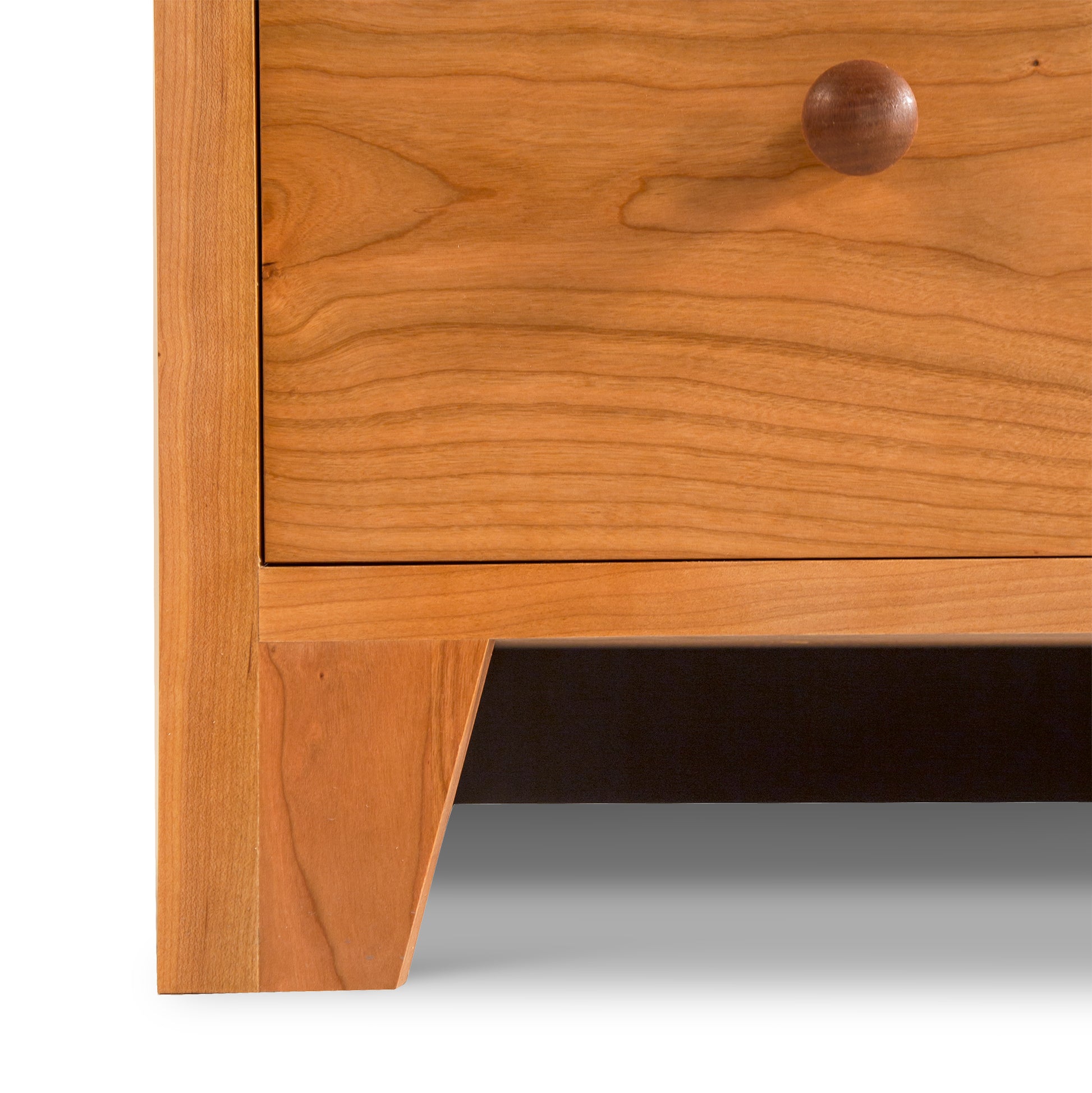 Round knob detail on Lyndon Furniture's American Country 6-Drawer Dresser with a light wood finish.