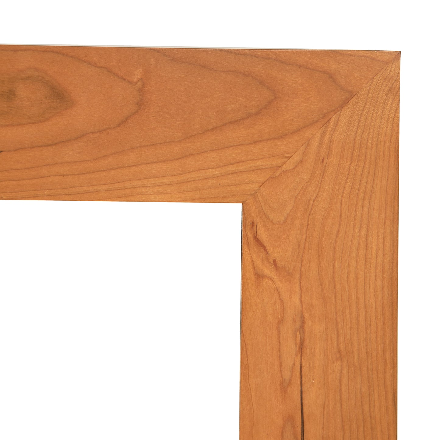 Lyndon Furniture American Country Mirror featuring a detailed view of its solid wood frame, highlighting the grain and precise miter joints.