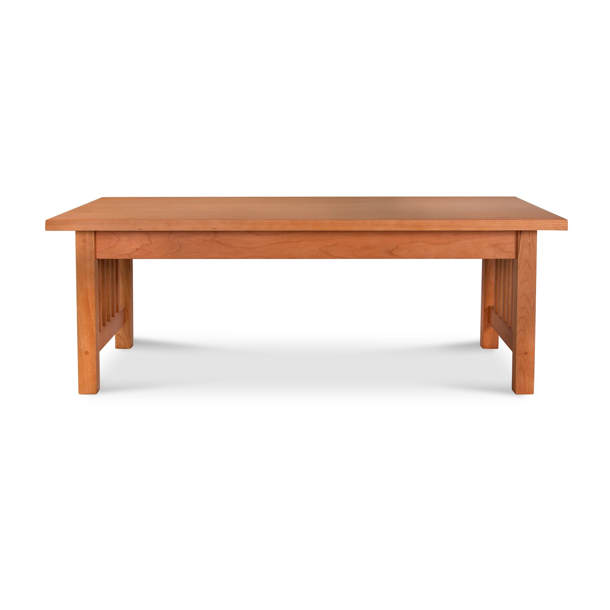 A handcrafted American-made American Mission Coffee Table with a wooden top on a white background by Lyndon Furniture.