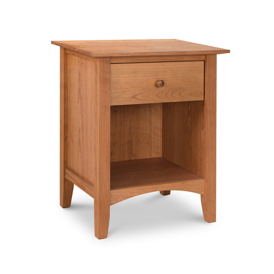 An American Shaker 1-Drawer Enclosed Shelf Nightstand by Maple Corner Woodworks, crafted from natural hardwoods with a single drawer and an open lower shelf, isolated on a white background.