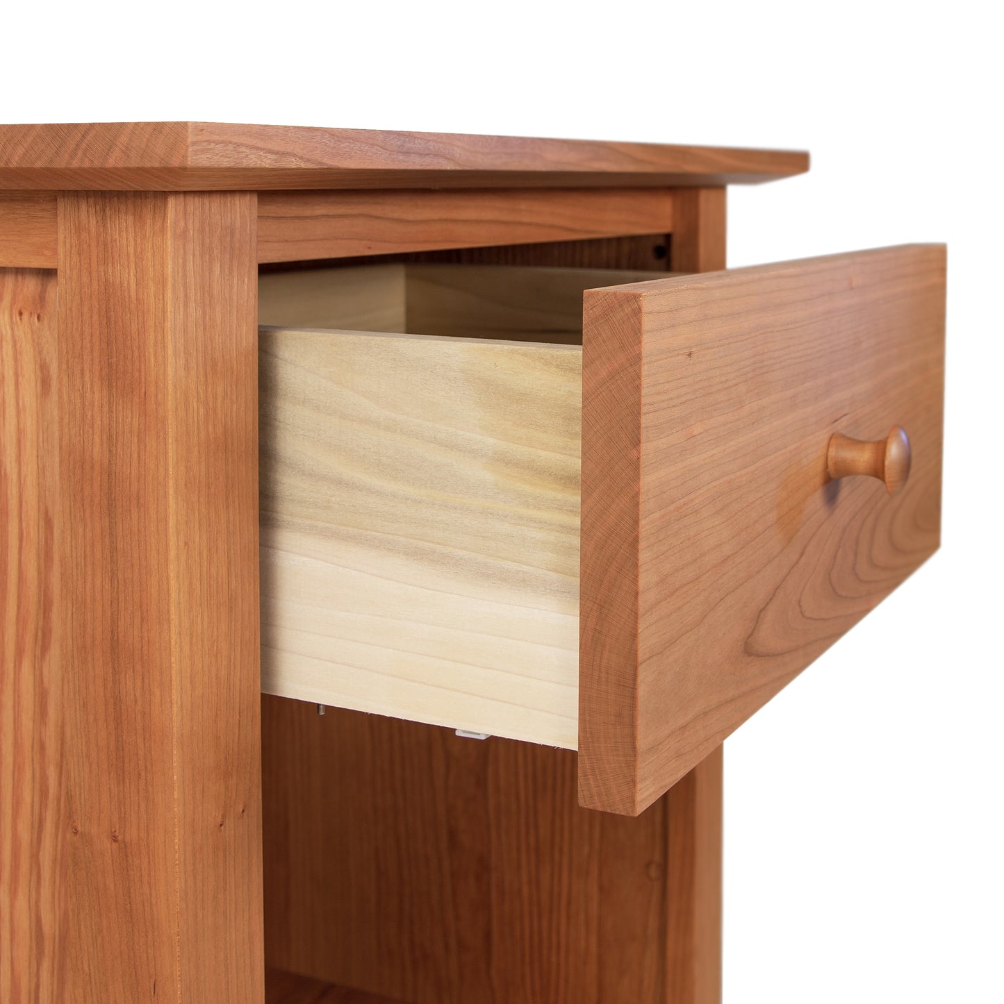 A Maple Corner Woodworks American Shaker 1-Drawer Enclosed Shelf Nightstand with an open drawer showing the interior construction and grain pattern, isolated on a white background.