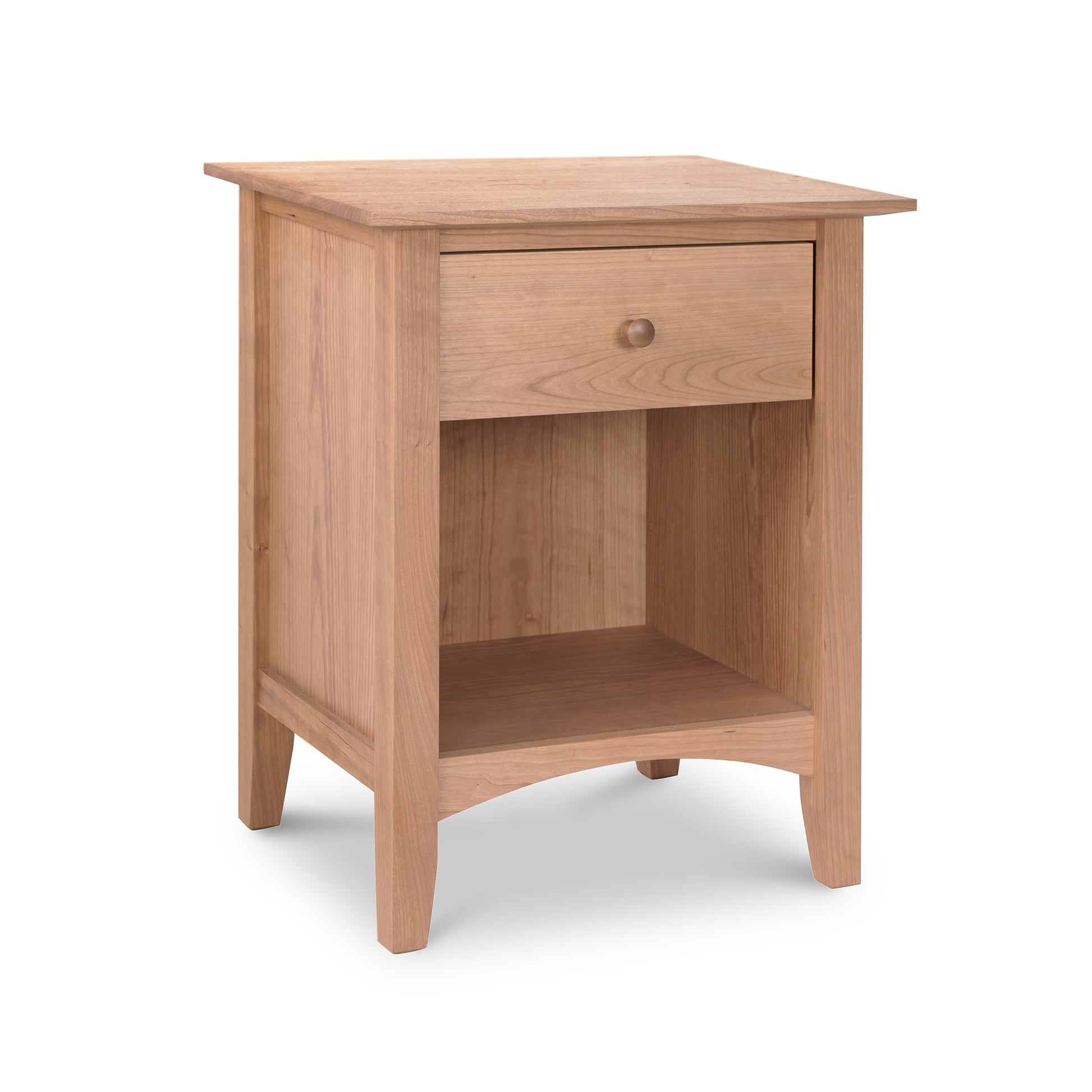 A Maple Corner Woodworks American Shaker 1-Drawer Enclosed Shelf Nightstand with a single drawer and an open lower shelf, isolated on a white background. The furniture, showcasing Vermont craftsmanship, features a simple design with a natural cherry finish.