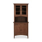 An Maple Corner Woodworks American Shaker Small 38" China Cabinet with an upper section sporting two glass-paneled doors and a lower cabinet section boasting two solid doors, against a white background. This piece is characterized by its solid hardwood construction.