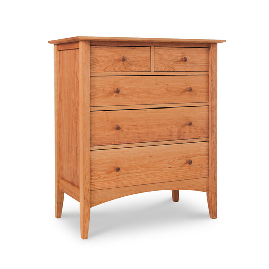 An American Shaker 5-Drawer Chest made from sustainably harvested wood by Maple Corner Woodworks, featuring a smooth finish and rounded handles, standing on tapered legs against a white background.