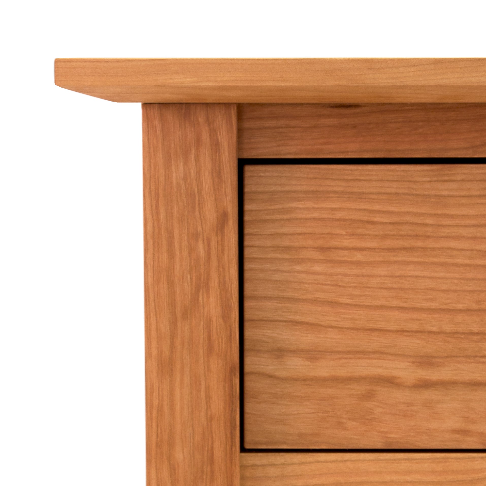 Close-up of a natural solid wood American Shaker 5-Drawer Chest corner showing detail of grain and structure from the Maple Corner Woodworks Collection.
