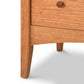 Close-up of a American Shaker 5-Drawer Chest from Maple Corner Woodworks featuring a single drawer with a round knob and splayed legs, against a white background.