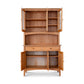 An Maple Corner Woodworks American Shaker 50" China Cabinet made of natural hardwood, with open doors and drawers, adjustable shelves, isolated on a white background.