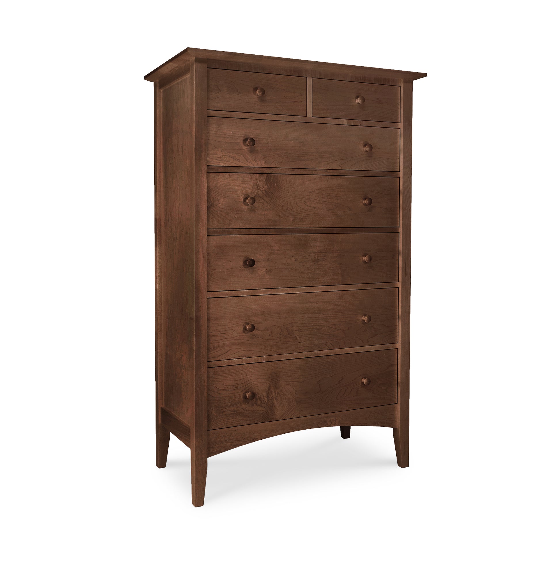 An eco-friendly American Shaker 7-Drawer Chest by Maple Corner Woodworks, featuring round knobs and standing on four tapered legs, isolated on a white background.