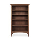A Maple Corner Woodworks American Shaker Bookcase crafted from sustainably harvested hardwoods, with four shelves, isolated on a white background.