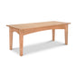 A simple American Shaker coffee table with a rectangular top and four sturdy legs, isolated on a white background. (Maple Corner Woodworks)