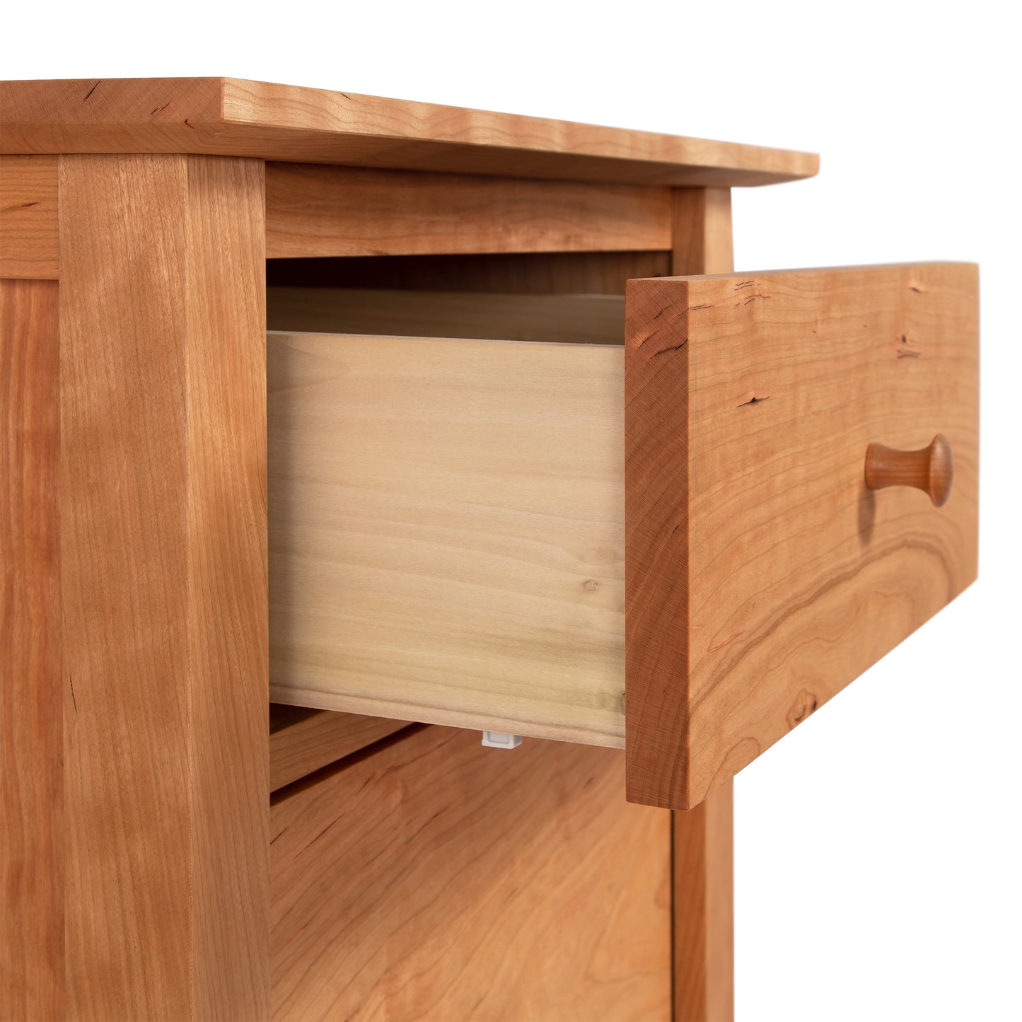 Round wooden handle on a classic American Shaker-style file cabinet drawer by Maple Corner Woodworks, showcasing its timeless elegance.