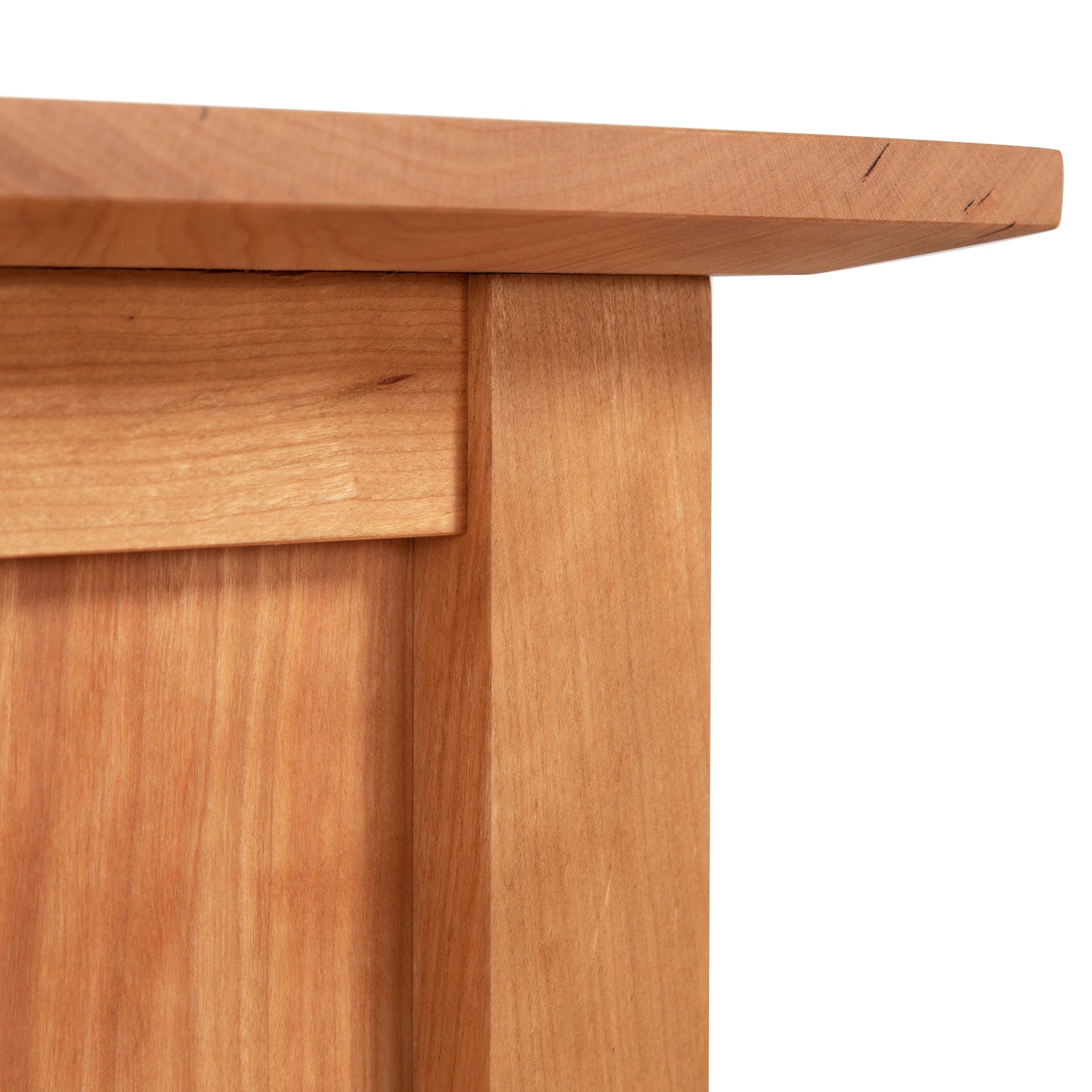 American Shaker File Cabinet by Maple Corner Woodworks featuring a close-up of its light brown wood texture and grain, highlighting the smooth, clean edges crafted with Vermont artisanship.