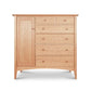 A Maple Corner Woodworks American Shaker Gent's Chest featuring a combination of drawers and a cabinet door, all with round knobs, set against a white background.