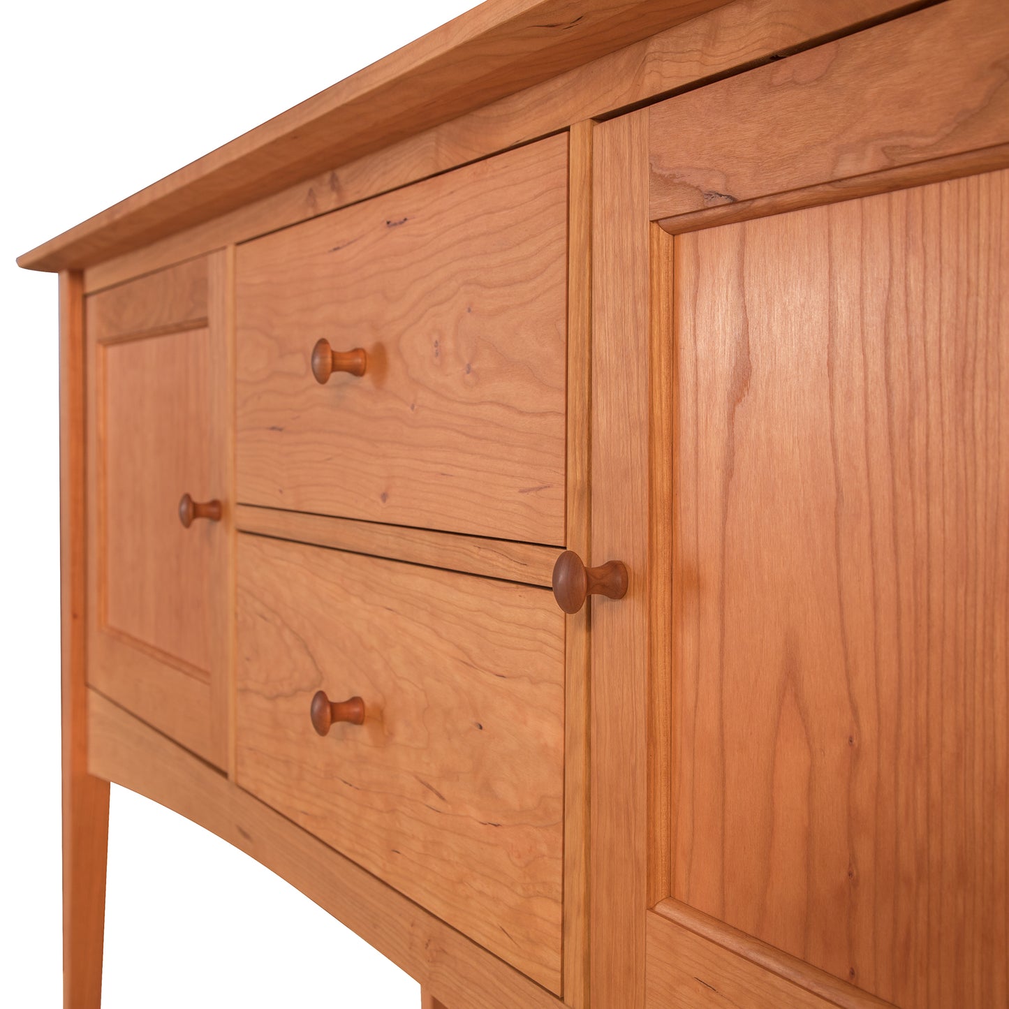Close-up view of an American Shaker Huntboard featuring multiple drawers with round knobs, crafted from solid hardwood construction with visible grain, isolated against a light background by Maple Corner Woodworks.