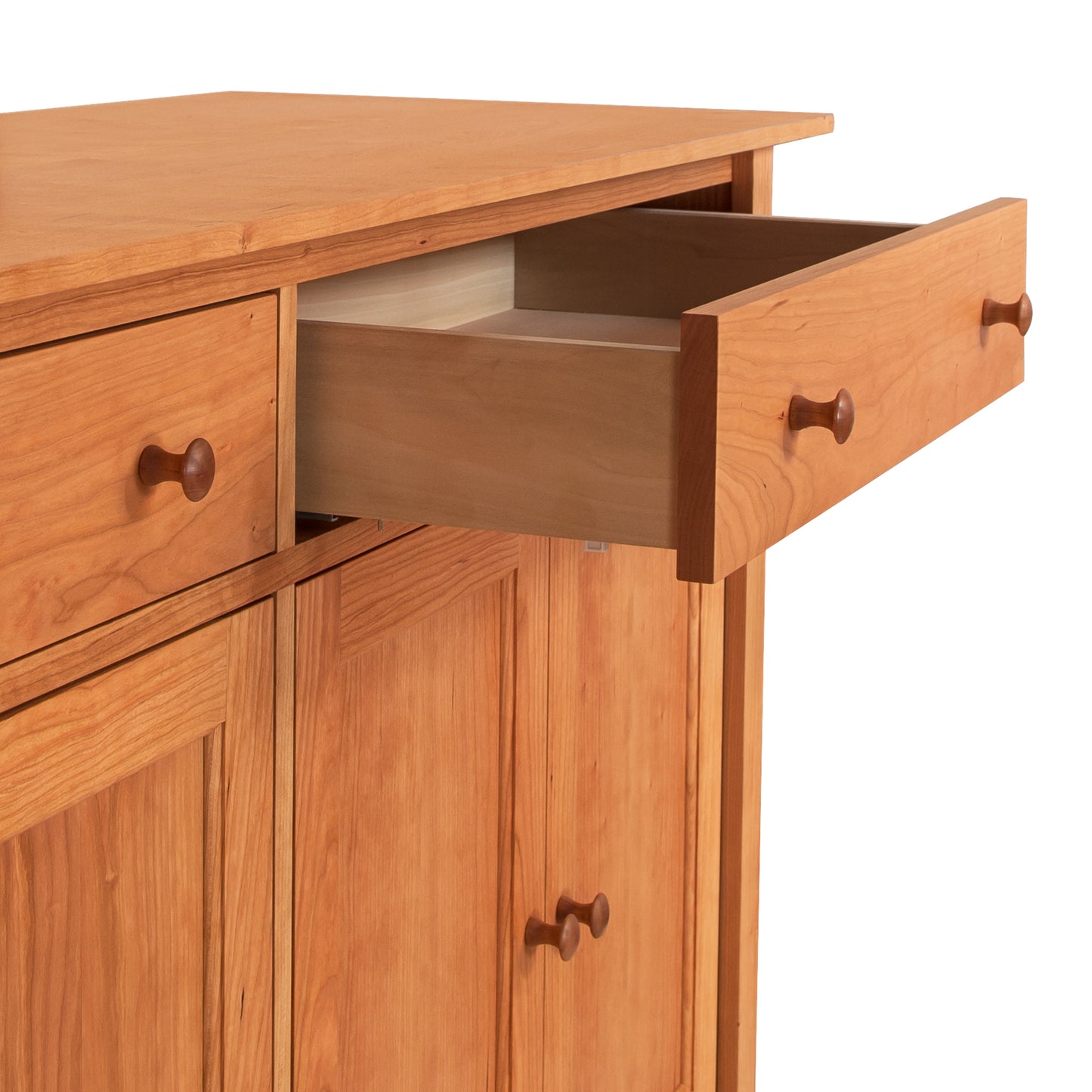 A Maple Corner Woodworks American Shaker Sideboard with an open drawer, revealing its empty interior. The sideboard features a simple design inspired by American Shaker style, with round drawer knobs and a smooth finish.