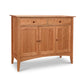 A Maple Corner Woodworks American Shaker Sideboard with two large doors and two drawers, crafted in Vermont, featuring round knobs and standing on slightly tapered legs against a white background.