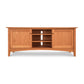 A Maple Corner Woodworks American Shaker 67" TV Stand with a curved front design, featuring two side cabinets and three open shelves in the center, isolated on a white background.