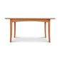 An Maple Corner Woodworks American Shaker Rectangular Solid Top Table with a smooth top and gently curved legs, isolated on a white background.