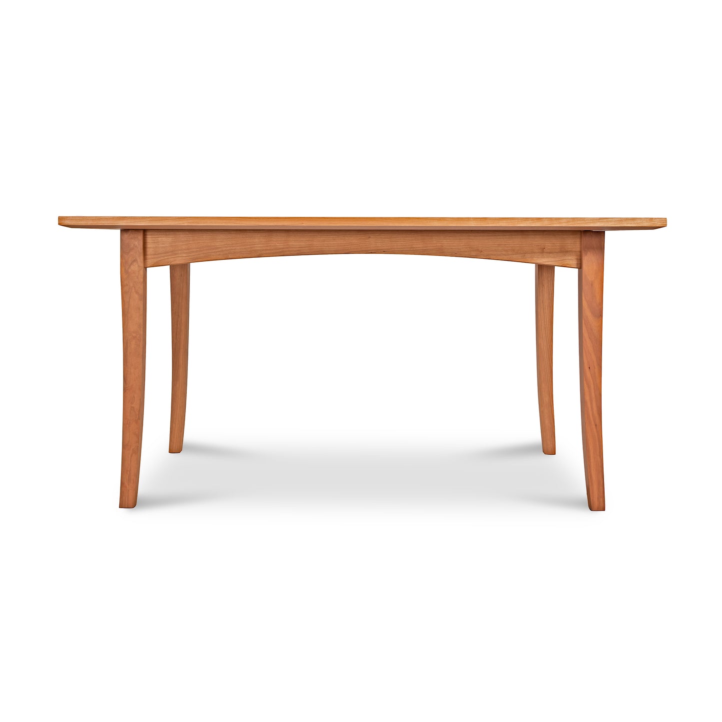 An Maple Corner Woodworks American Shaker Rectangular Solid Top Table with a smooth top and gently curved legs, isolated on a white background.