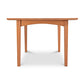 A simple American Shaker Rectangular Solid Top Table with a smooth, curved tabletop and four straight legs, isolated on a white background, from Maple Corner Woodworks.