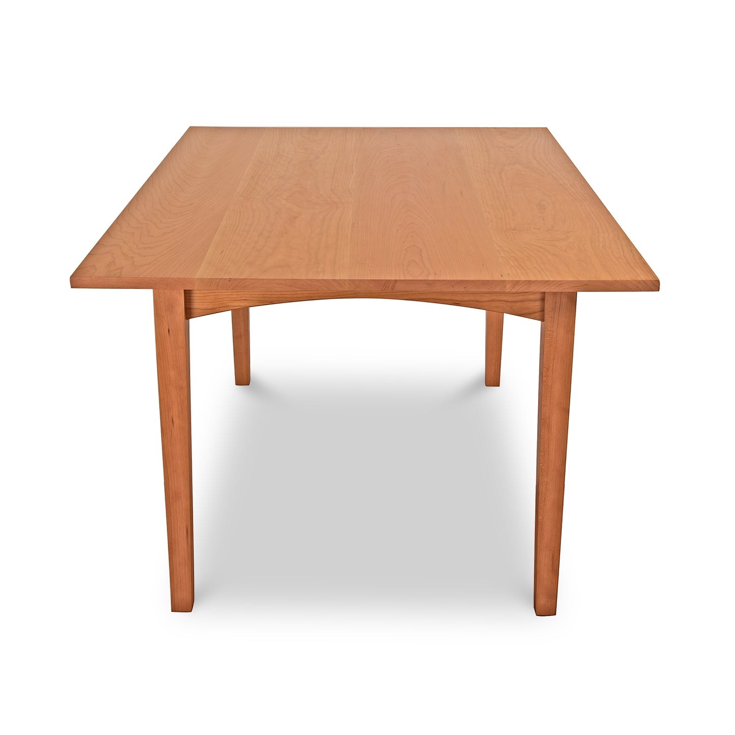 A simple Maple Corner Woodworks American Shaker Rectangular Solid Top Table with a smooth finish and four sturdy legs, isolated on a white background.