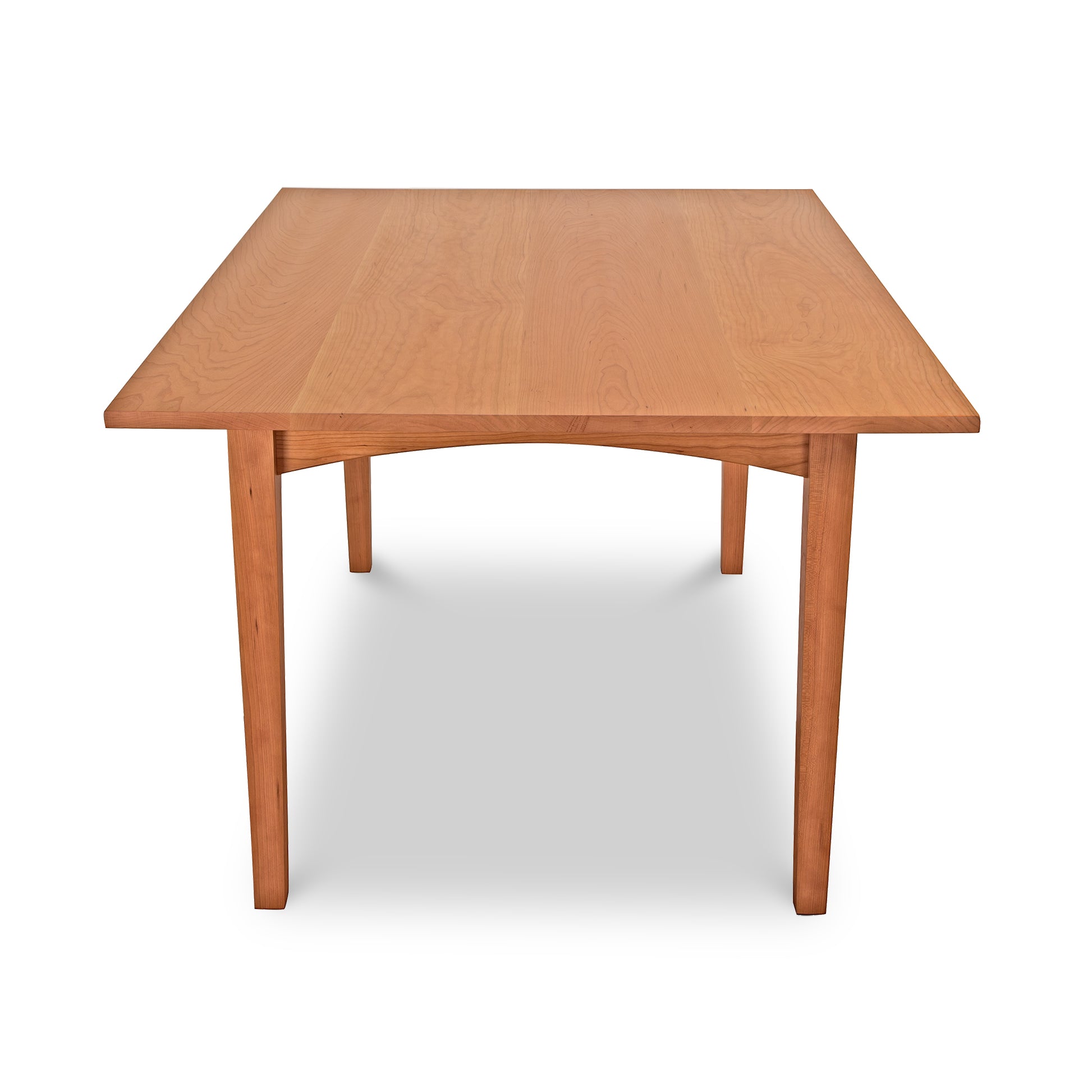 A simple Maple Corner Woodworks American Shaker Rectangular Solid Top Table with a smooth finish and four sturdy legs, isolated on a white background.