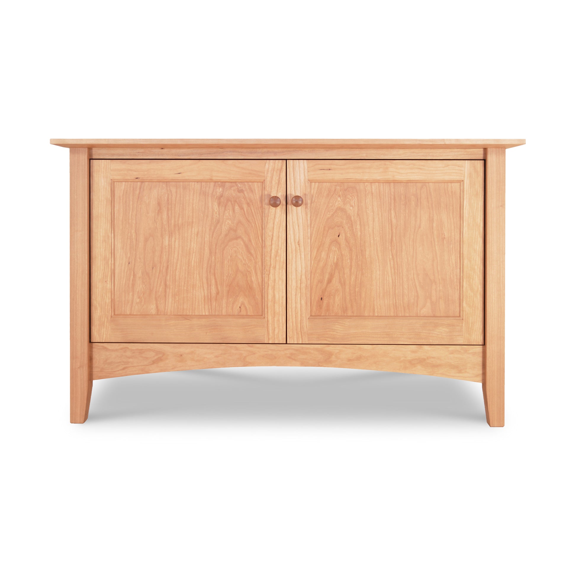 A American Shaker 48" TV Stand crafted from solid hardwoods by Maple Corner Woodworks, featuring two cabinet doors and curved legs, isolated on a white background.
