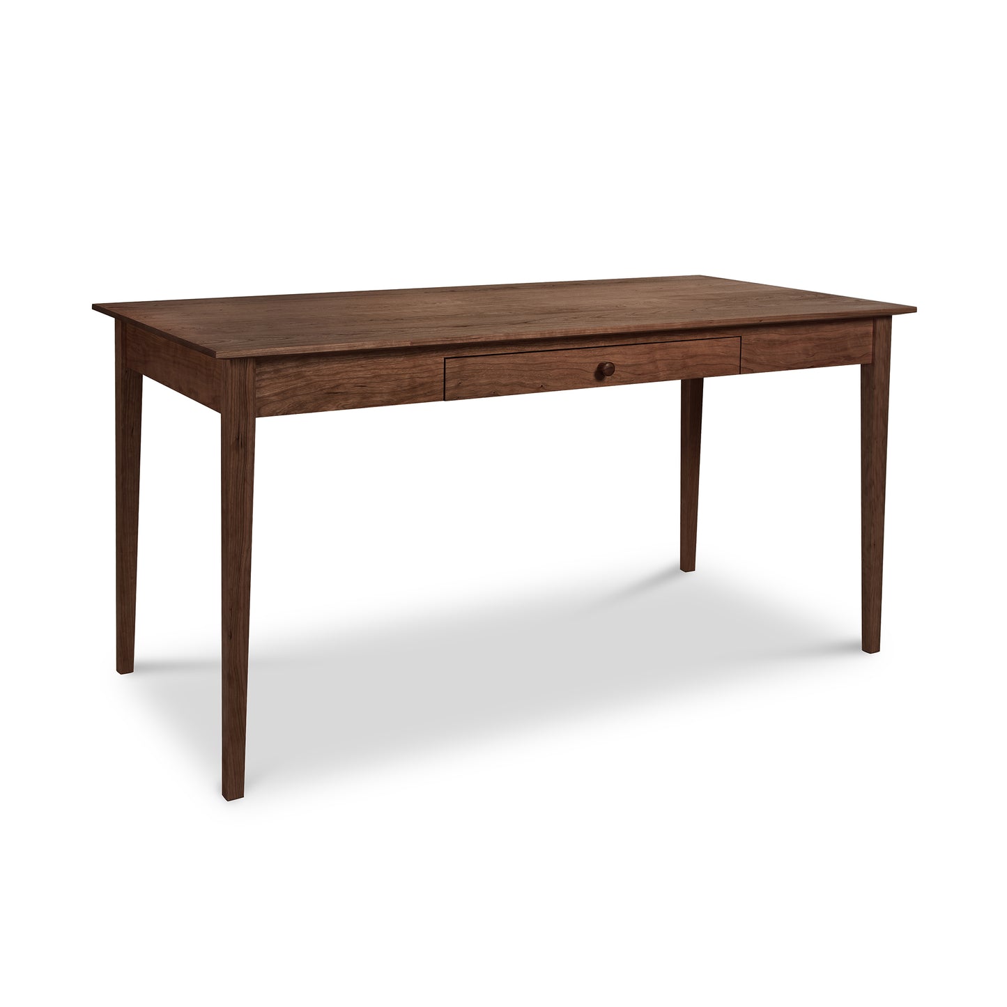 Vermont craftsmen-designed Maple Corner Woodworks American Shaker Writing Desk, a wooden table with a single drawer, crafted from sustainably harvested hardwood against a white background.