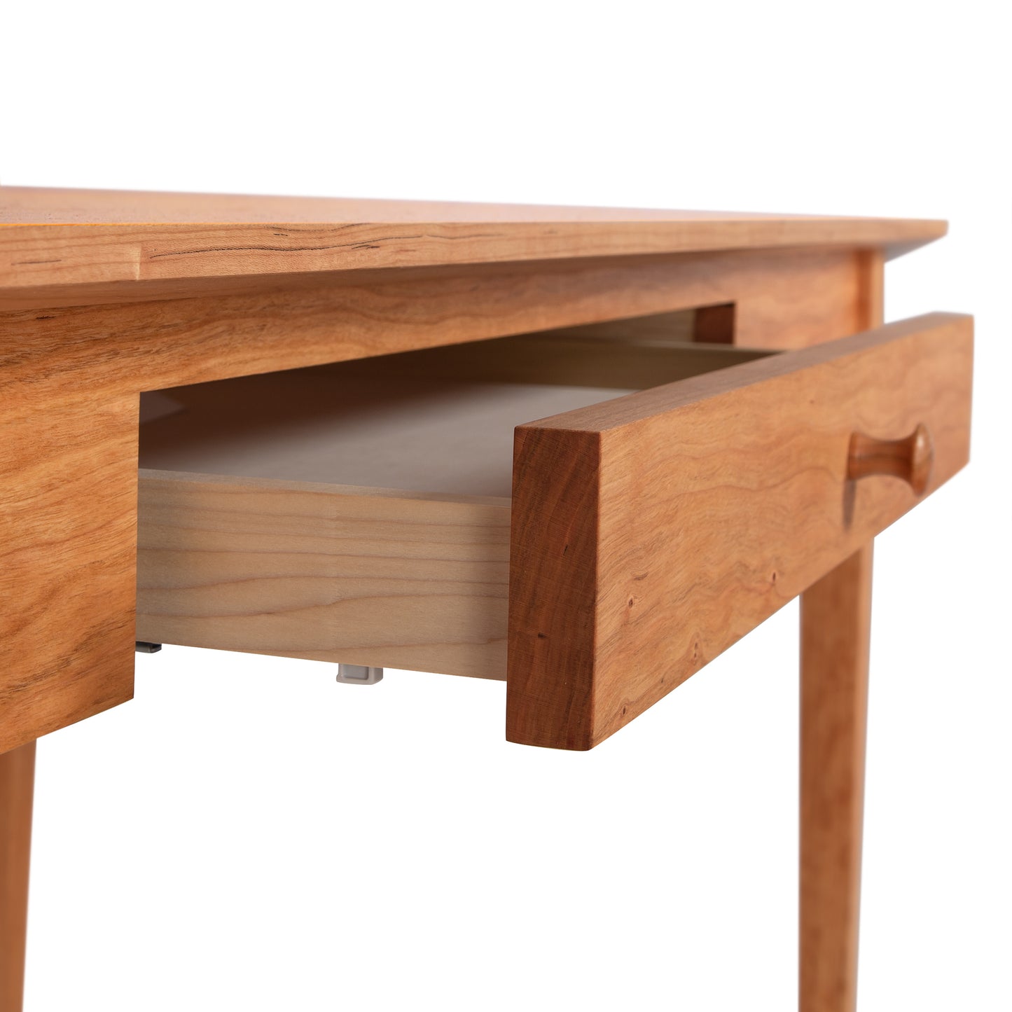 American Shaker Writing Desk, a beautifully crafted wooden table with a partially open drawer, featuring a smooth finish and minimalist design from sustainably harvested hardwood by Vermont artisans.