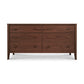 A wooden dresser with six drawers, known as the Maple Corner Woodworks Andover Modern 6-Drawer Dresser, features a rich brown finish and sleek, horizontal handles. The dresser has a minimalist design with smooth.