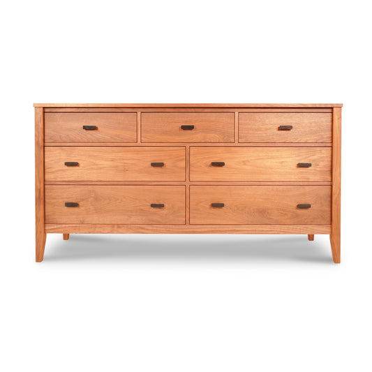 An Maple Corner Woodworks Andover Modern 7-Drawer Dresser crafted from natural cherry, with six drawers each featuring a single knob, stands against a white background.