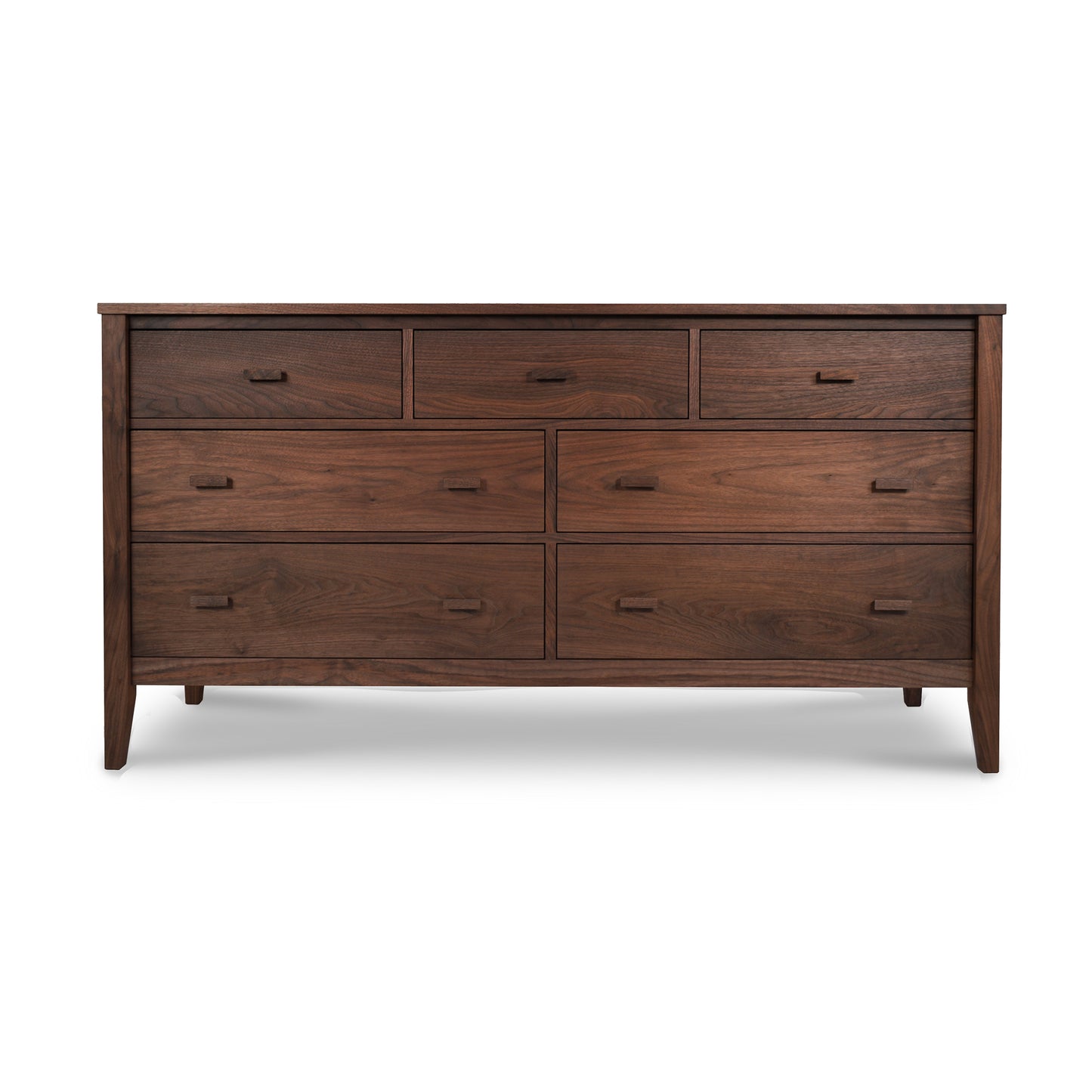 A large wooden Maple Corner Woodworks Andover Modern 7-Drawer Dresser, featuring a rich dark brown finish and slightly tapered legs, isolated on a white background.
