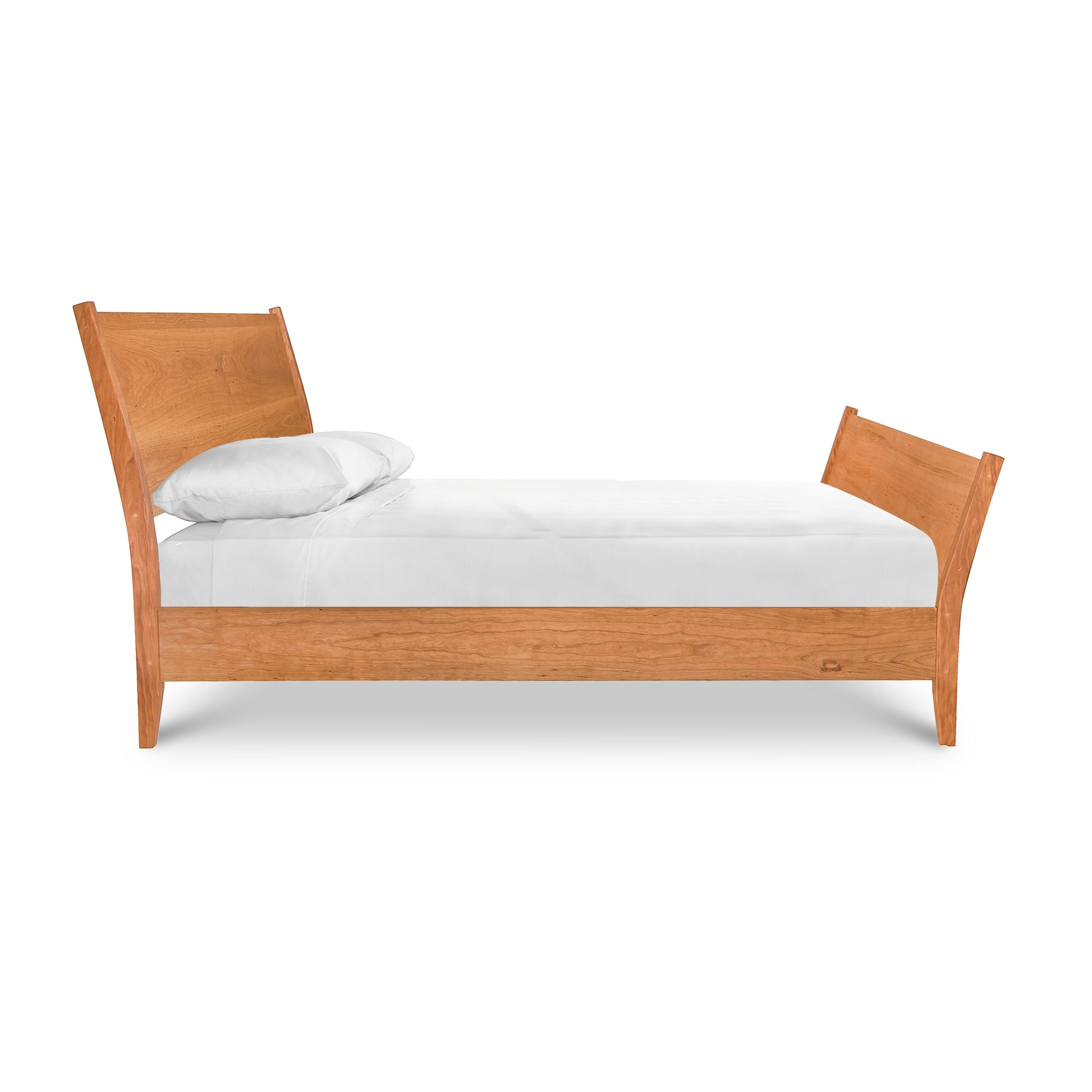 A Maple Corner Woodworks Andover Modern Incline Sleigh Bed design with a white mattress and a single pillow against a white background.