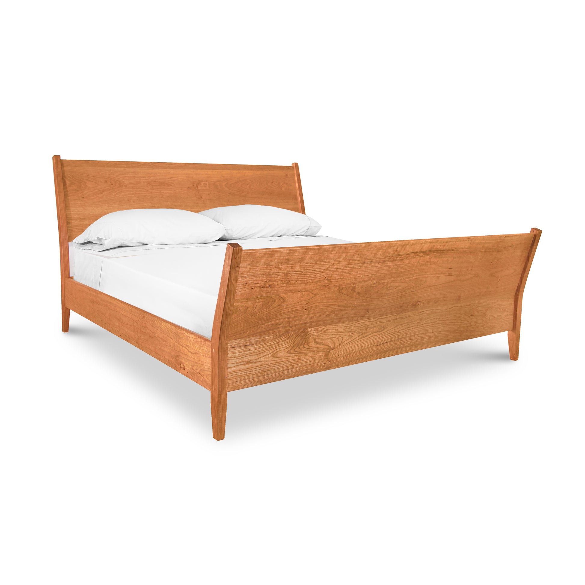 A Maple Corner Woodworks Andover Modern Incline Sleigh Bed with a white mattress and two pillows set against a white background.