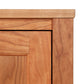 Close-up view of an Andover Modern 64" TV Stand cabinet door from Maple Corner Woodworks, showcasing sustainable hardwood construction and a seamless joinery technique. The photo includes the frame and a part of the door panel against a white background.