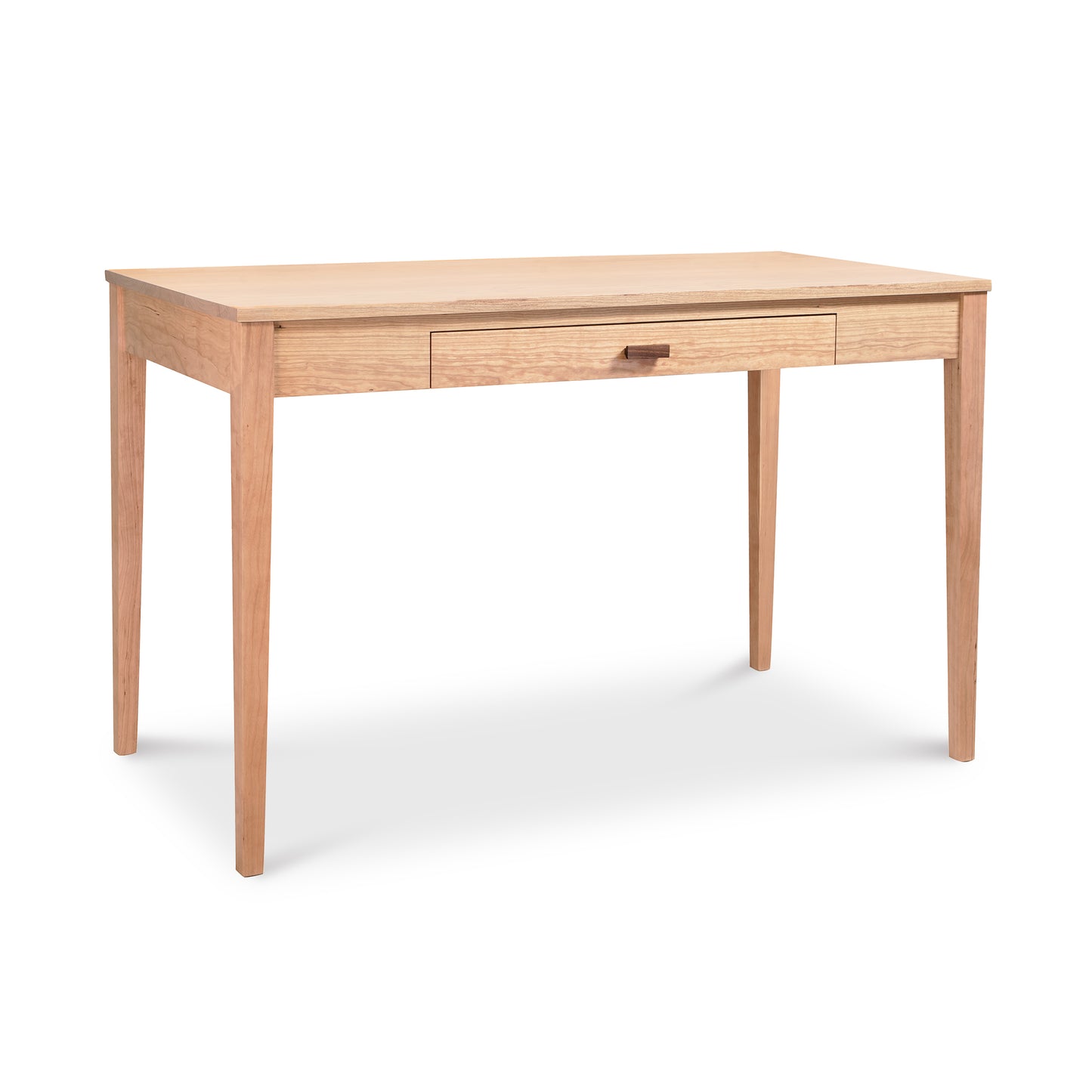 An Maple Corner Woodworks Andover Modern Writing Desk, crafted from solid wood in a natural cherry finish, with a single centered drawer, isolated on a white background.