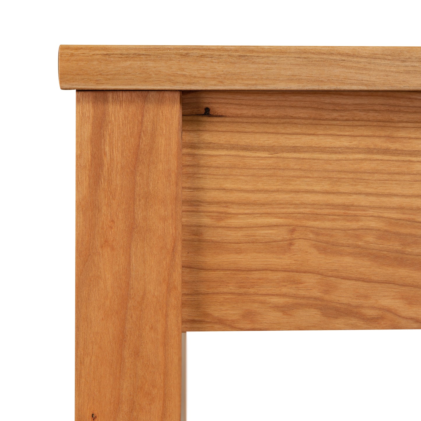 Andover Modern Writing Desk corner featuring a natural finish and distinctive grain patterns, exemplifying Maple Corner Woodworks' solid wood craftsmanship.