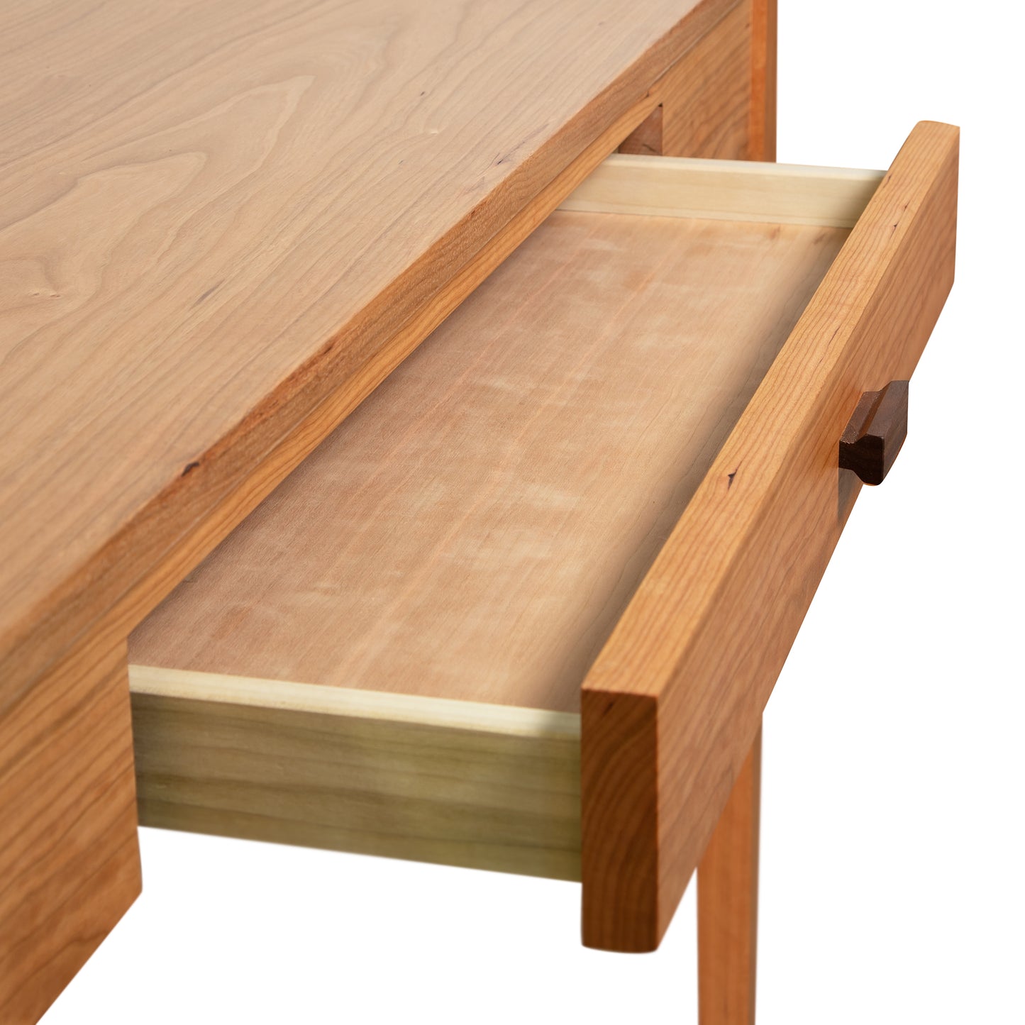 Andover Modern Writing Desk by Maple Corner Woodworks featuring a handcrafted wooden table with an open drawer showcasing a lighter wood interior.