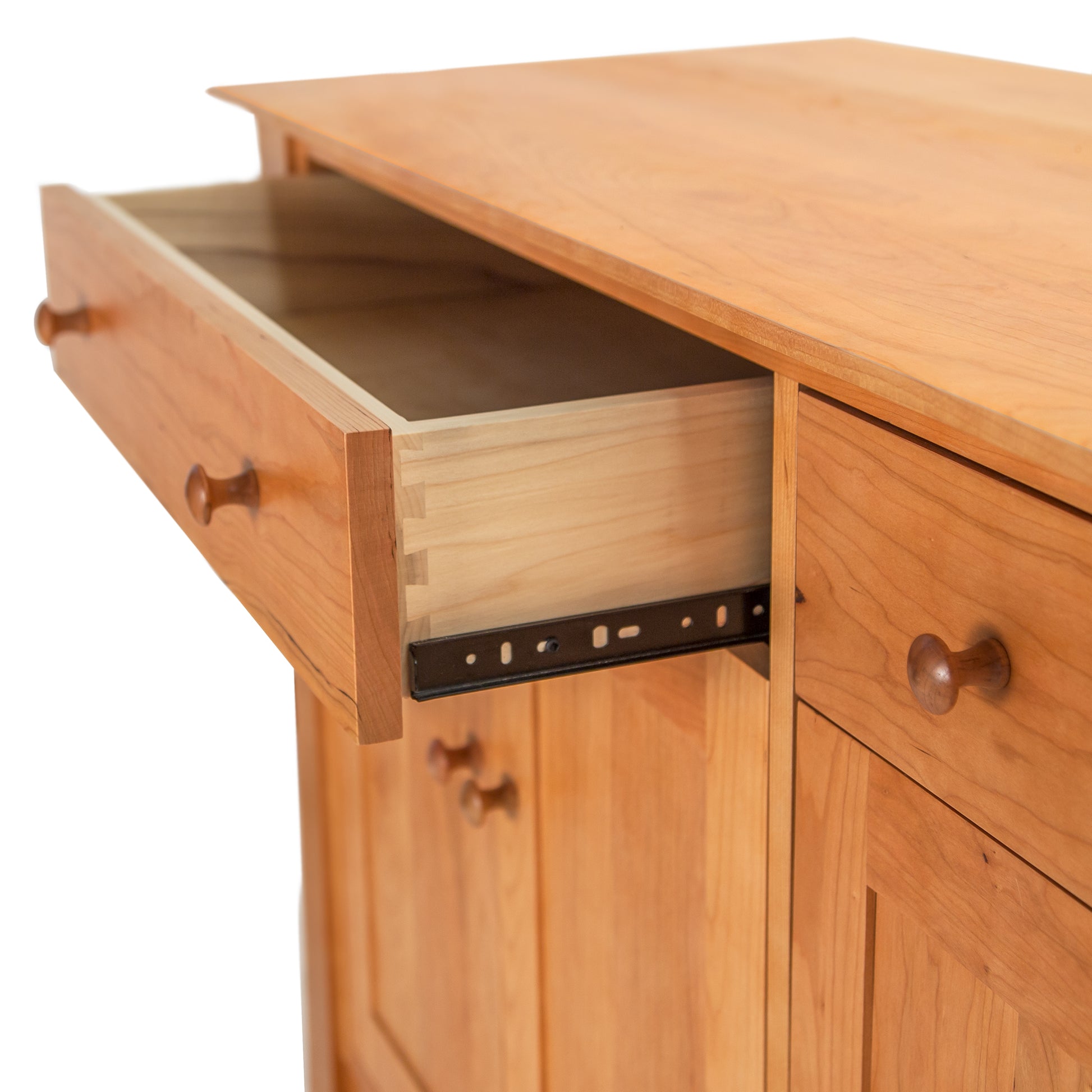 A contemporary Andrews Buffet with an open drawer made of natural cherry wood by Lyndon Furniture.