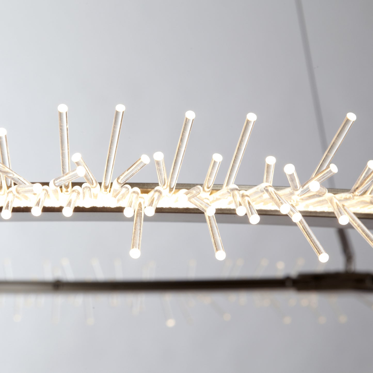 Anemone Circular LED Pendant with branching LED bristles by Hubbardton Forge, emitting a warm glow.