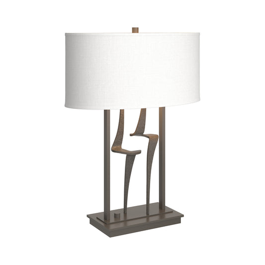 Antasia #1 Table Lamp by Hubbardton Forge featuring a hand-forged iron base in bronze finish and a rectangular white shade, showcasing fine American craftsmanship.